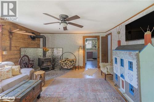 1429 Tamarack Lake Road, Highlands East, ON - Indoor Photo Showing Other Room With Fireplace