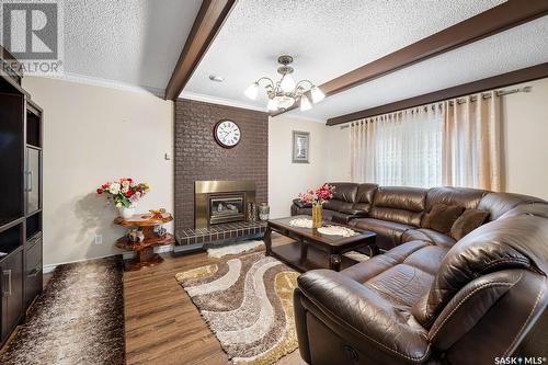 90 Groome Avenue, Regina, SK - Indoor Photo Showing Living Room With Fireplace
