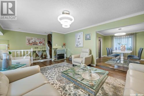 90 Groome Avenue, Regina, SK - Indoor Photo Showing Living Room With Fireplace