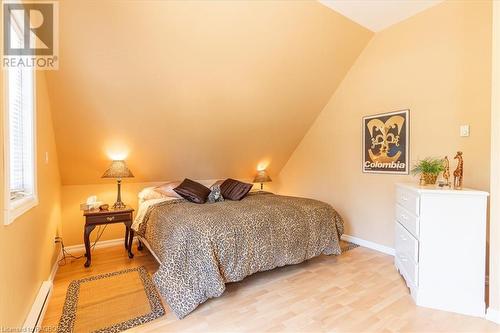 Primary bedroom with access to the upper balcony - 108 Fedy Drive, Sauble Beach, ON - Indoor Photo Showing Bedroom