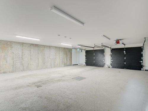 Garage - 144 Rue D'Émeraude, Candiac, QC - Indoor Photo Showing Garage