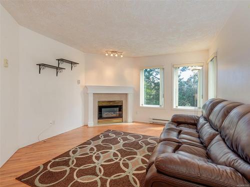 308-490 Marsett Pl, Saanich, BC - Indoor Photo Showing Living Room With Fireplace