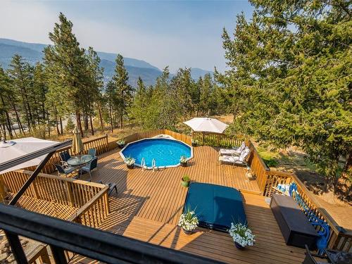 1996 Tomat Avenue, Kelowna, BC - Outdoor With Above Ground Pool With Deck Patio Veranda
