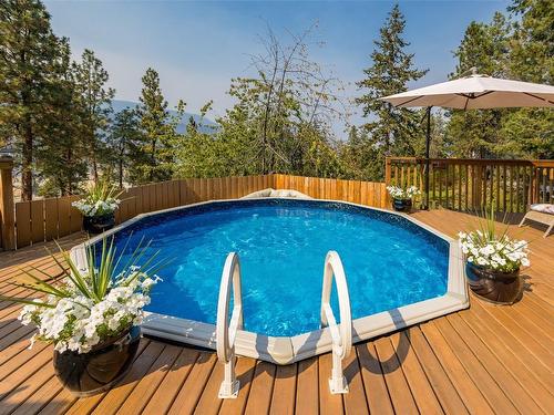 1996 Tomat Avenue, Kelowna, BC - Outdoor With Above Ground Pool With Deck Patio Veranda With Backyard