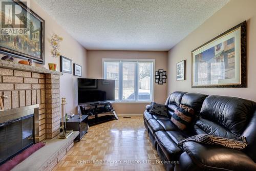 249 Mossbrook Square, Pickering, ON - Indoor Photo Showing Living Room With Fireplace