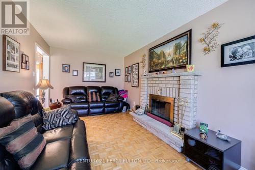 249 Mossbrook Square, Pickering, ON - Indoor Photo Showing Living Room With Fireplace