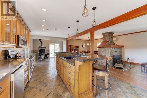 1298 Belgo Road, Kelowna, BC - Indoor Photo Showing Kitchen With Fireplace