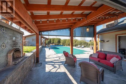 1298 Belgo Road Lot# A, Kelowna, BC -  With Fireplace With In Ground Pool With Deck Patio Veranda With Exterior