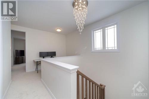 2nd floor with stunning chandelier - 655 Persimmon Way, Ottawa, ON - Indoor Photo Showing Other Room