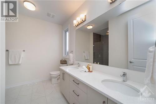 Ensuite Bath with quartz counters and his and hers sinks - 655 Persimmon Way, Ottawa, ON - Indoor Photo Showing Bathroom