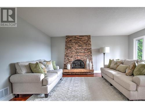 12311 Husband Road, Coldstream, BC - Indoor Photo Showing Living Room With Fireplace