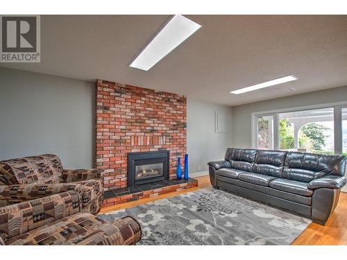 12311 Husband Road, Coldstream, BC - Indoor Photo Showing Living Room With Fireplace