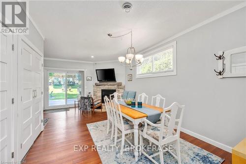 8471 Defore Drive, Lambton Shores, ON - Indoor Photo Showing Dining Room With Fireplace