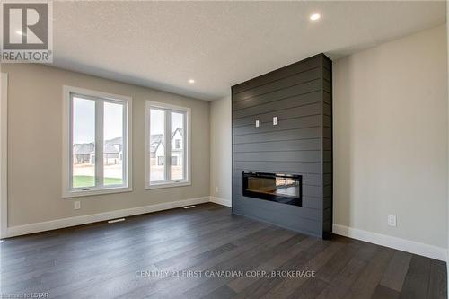 100 Aspen Circle, Thames Centre, ON - Indoor With Fireplace
