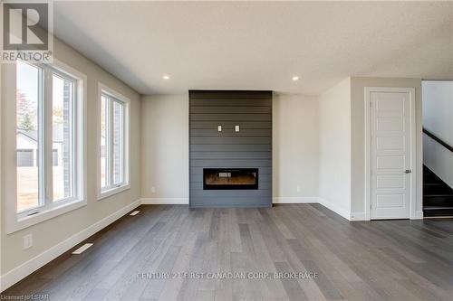 100 Aspen Circle, Thames Centre, ON - Indoor Photo Showing Living Room With Fireplace