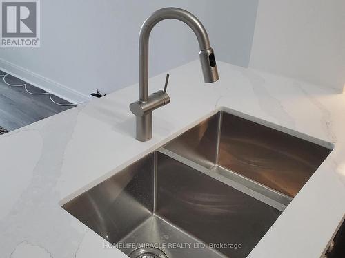 306 - 50 Absolute Avenue, Mississauga, ON - Indoor Photo Showing Kitchen With Double Sink