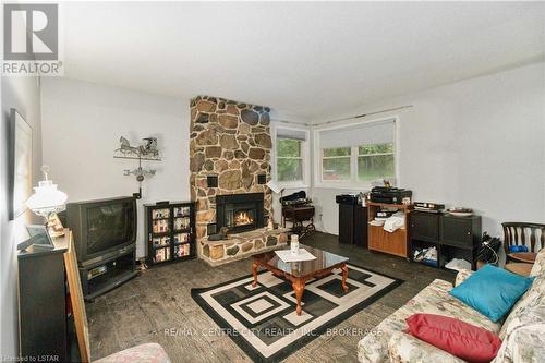 30622 Hungry Hollow Road, North Middlesex, ON - Indoor Photo Showing Living Room With Fireplace
