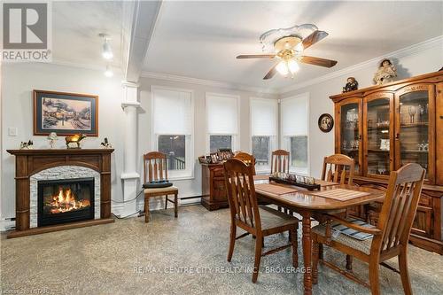 30622 Hungry Hollow Road, North Middlesex, ON - Indoor Photo Showing Dining Room With Fireplace