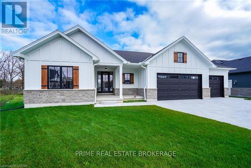 9 Spruce Crescent, North Middlesex, ON - Outdoor With Facade