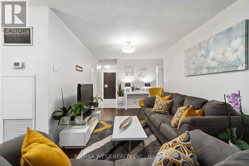 301 - 3233 Eglinton Avenue E, Toronto, ON - Indoor Photo Showing Living Room