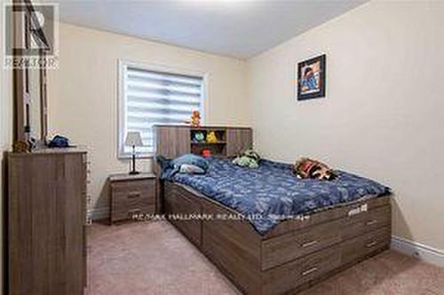 33 Lorne Thomas Place, New Tecumseth, ON - Indoor Photo Showing Bedroom