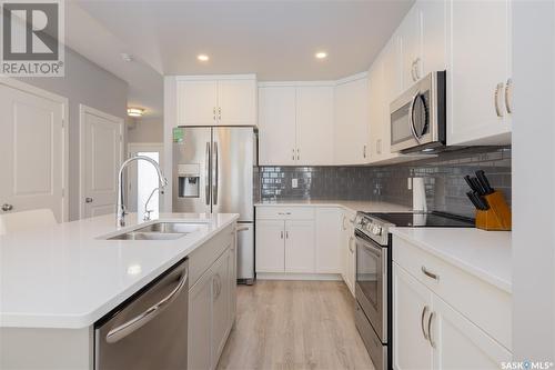 228 Brighton Gate, Saskatoon, SK - Indoor Photo Showing Kitchen With Double Sink With Upgraded Kitchen