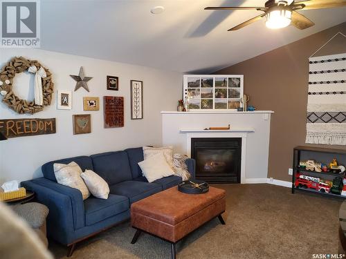 730 5Th Avenue Ne, Swift Current, SK - Indoor Photo Showing Living Room With Fireplace