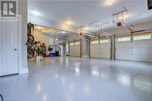 Triple garage with epoxy floor - 1 Mccannel Lane, Saugeen Shores, ON - Indoor Photo Showing Garage