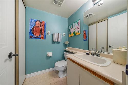2-piece powder room for guests, plus linen closet - 1270 Maple Crossing Boulevard|Unit #204, Burlington, ON - Indoor Photo Showing Bathroom