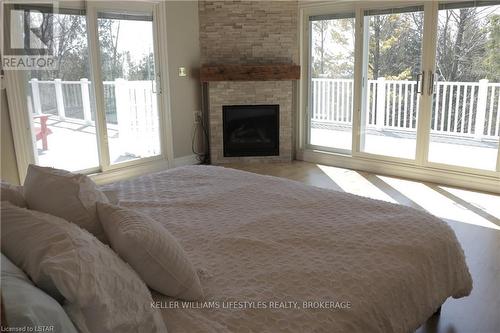73475 Aviator Lane, Bluewater, ON - Indoor Photo Showing Bedroom With Fireplace