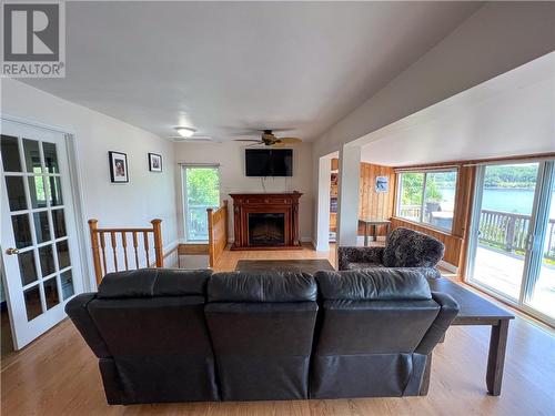 1081 Sunnyside Drive, Algoma Mills, ON - Indoor Photo Showing Living Room With Fireplace