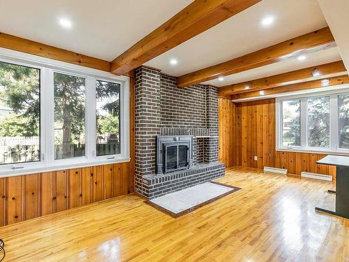 Salle familiale - 97 Rue Chatillon, Dollard-Des-Ormeaux, QC - Indoor With Fireplace