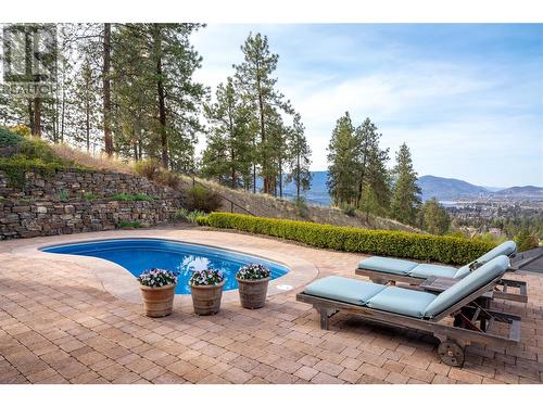 605 Almandine Court, Kelowna, BC - Outdoor With In Ground Pool With Backyard
