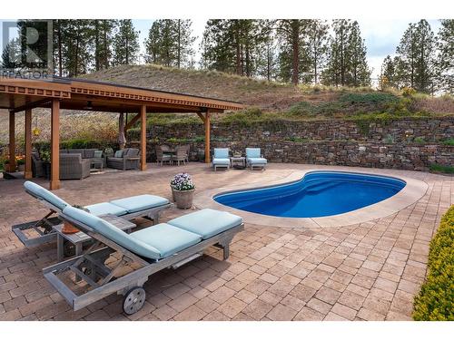605 Almandine Court, Kelowna, BC - Outdoor With In Ground Pool With Deck Patio Veranda With Backyard