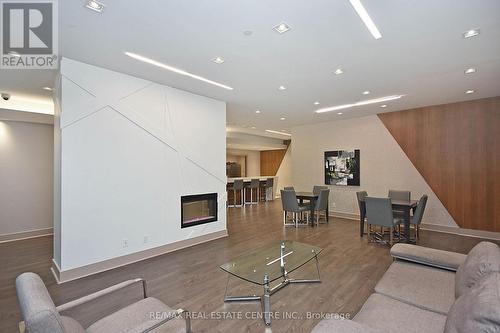 2010 - 75 Eglinton Avenue W, Mississauga, ON - Indoor Photo Showing Living Room With Fireplace