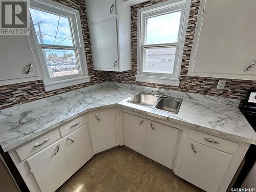 108 Carl Avenue W, Langenburg, SK - Indoor Photo Showing Kitchen With Double Sink
