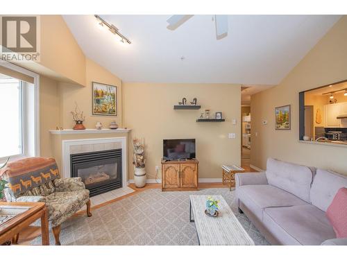 3301 Centennial Drive Unit# 406, Vernon, BC - Indoor Photo Showing Living Room With Fireplace