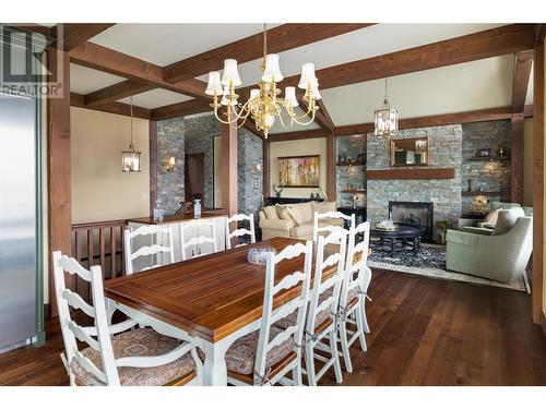 6166 Seymoure Avenue, Peachland, BC - Indoor Photo Showing Dining Room With Fireplace