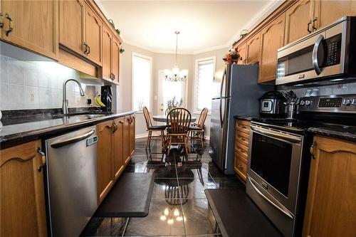 Stainless appliances, granite countertops - 5 Greentrail Drive, Mount Hope, ON - Indoor Photo Showing Kitchen