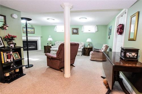 finished rec room are in basement - 5 Greentrail Drive, Mount Hope, ON - Indoor With Fireplace