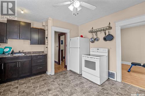 344 15Th Street W, Prince Albert, SK - Indoor Photo Showing Kitchen With Double Sink