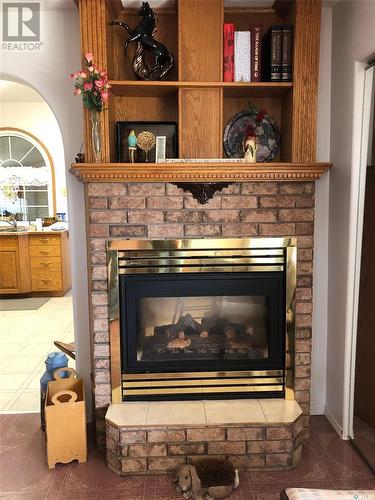 28 Highway Avenue W, Preeceville, SK - Indoor Photo Showing Living Room With Fireplace