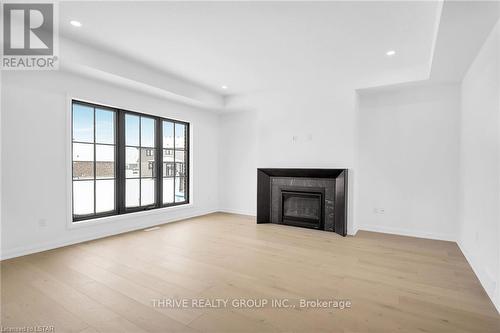 14 Aspen Circle, Thames Centre, ON - Indoor Photo Showing Living Room With Fireplace