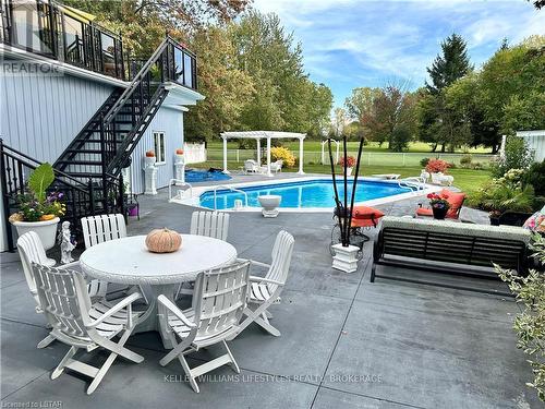 33380 Queen Street, North Middlesex, ON - Outdoor With In Ground Pool With Deck Patio Veranda