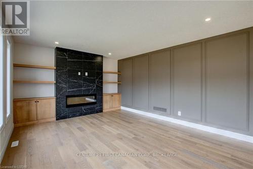 58 Aspen Circle, Thames Centre, ON - Indoor Photo Showing Other Room With Fireplace