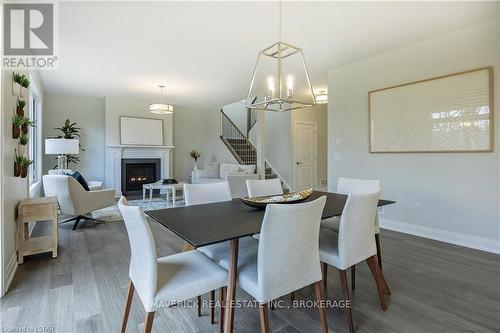 2195 Lockwood Crescent, Strathroy-Caradoc, ON - Indoor Photo Showing Dining Room With Fireplace