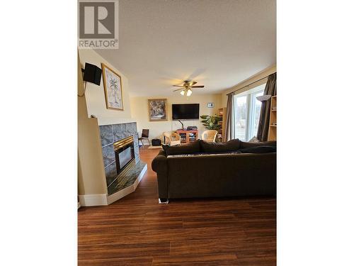 5112 43 Street Ne, Chetwynd, BC - Indoor Photo Showing Living Room With Fireplace