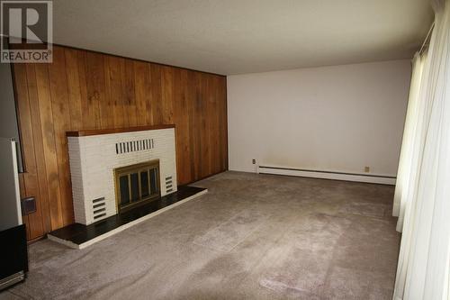 217 6Th Street, Nakusp, BC - Indoor Photo Showing Other Room With Fireplace