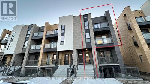 E21 - 261 Woodbine Avenue, Kitchener, ON - Outdoor With Balcony With Facade