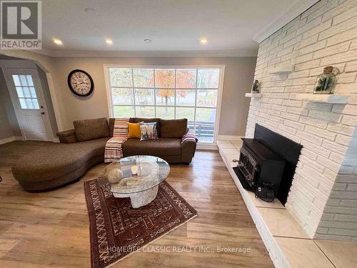 1015 Westmount Avenue, Innisfil, ON - Indoor Photo Showing Living Room With Fireplace